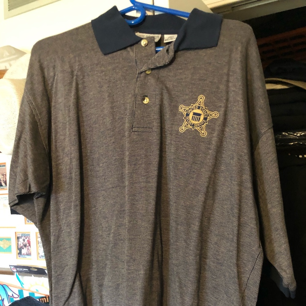 Golf shirt with embroidered Secret Service star.
